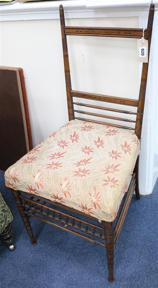 A Regency rosewood spindle turned bedroom chair, with an upholstered seat
